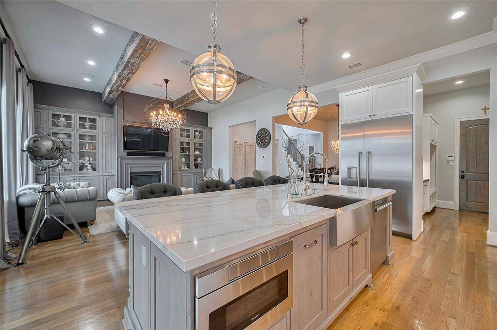 The kitchen's open-concept design allows for effortless flow, with sightlines that stretch across the beautifully appointed living space. Whether prepping at the island or hosting a gathering, this layout ensures you’re always part of the conversation in a home that’s built for connection and comfort.