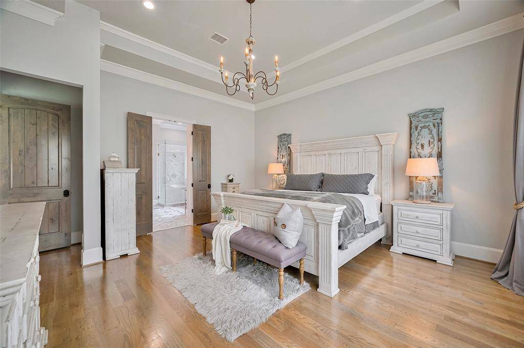 From the primary bedroom, enjoy a seamless view into the spa-like ensuite bathroom, creating a sense of flow and retreat. Solid wood doors throughout add a touch of timeless quality, complementing the room’s elevated design and luxurious finishes. A perfect blend of comfort, craftsmanship, and sophistication.