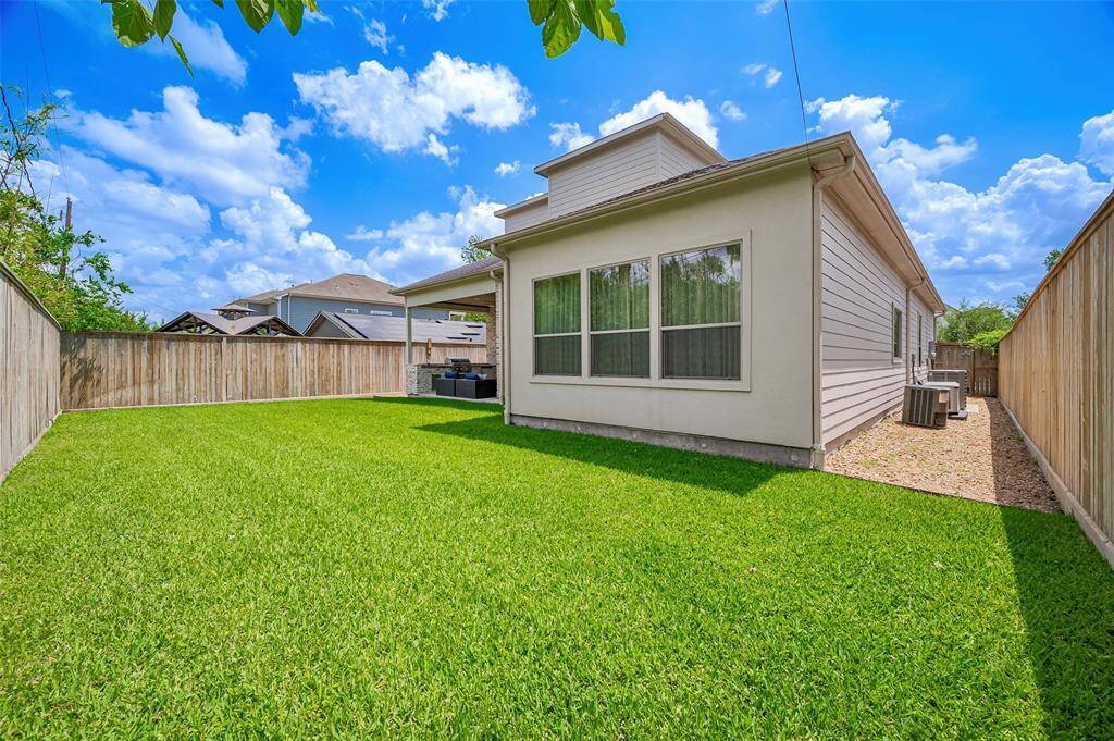 The pool-ready backyard offers lush green grass and plenty of space to create your dream outdoor oasis. A whole-house generator ensures comfort and peace of mind year-round, adding value and reliability to this beautiful outdoor space.