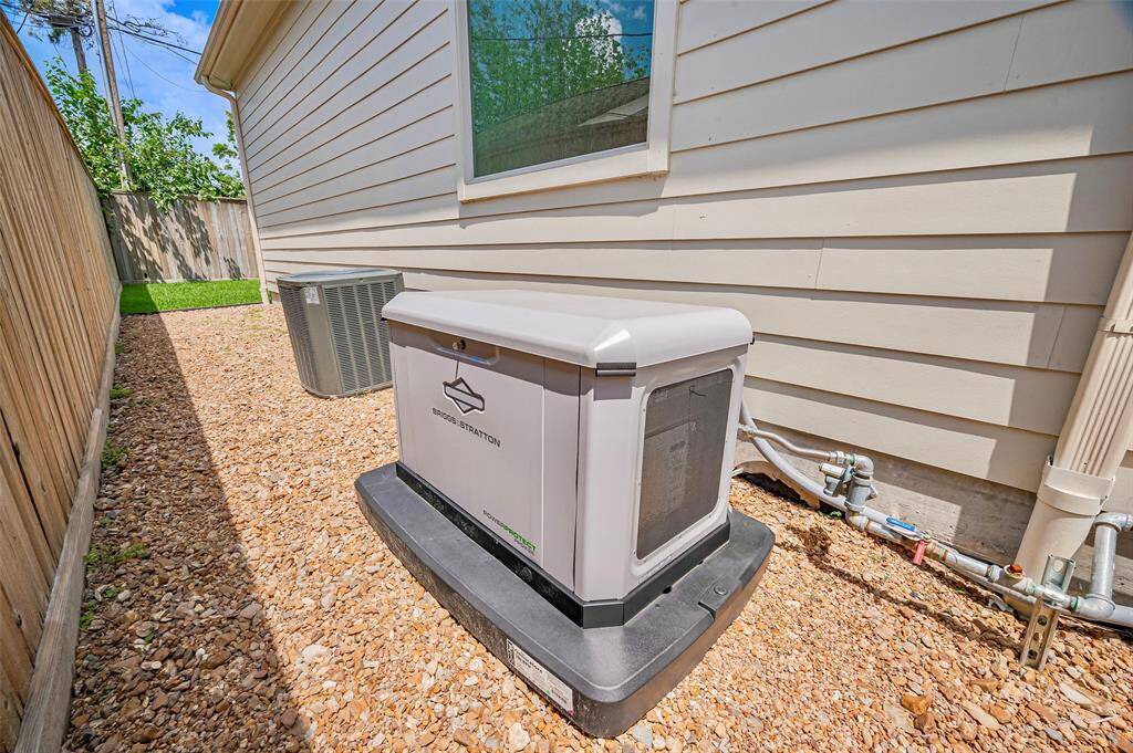 The backyard is pool-ready, with lush green grass and ample space to design your ideal retreat. A Briggs & Stratton whole-house generator provides reliable backup power and is sized to support a future pool, ensuring comfort and convenience in every season.