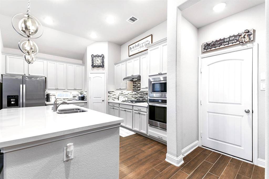 Kitchen includes stainless steel appliances, gas burner cooktop, dishwasher that has barely been used, and cute coffee nook area!
