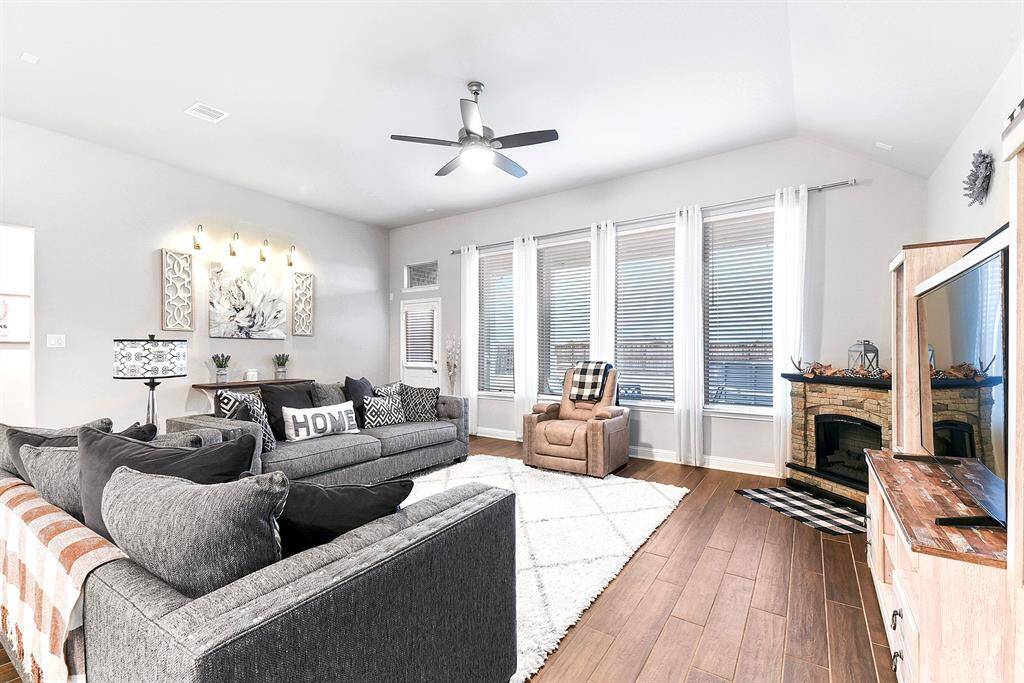Natural light floods into family and dining room.  Electric fireplace can be included!
