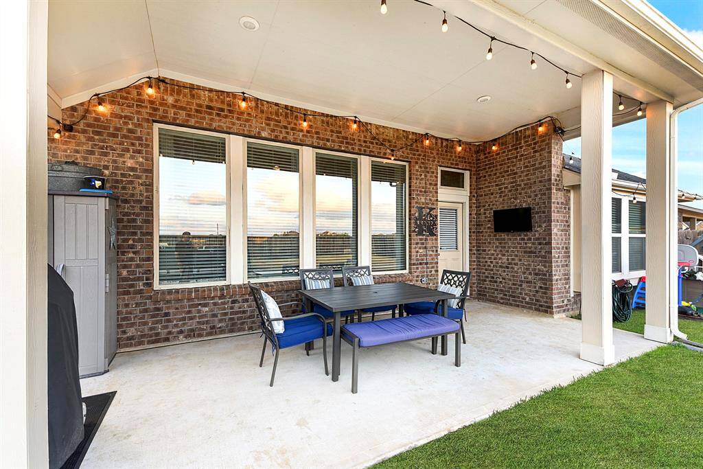 Expansive upgraded covered patio, perfect for barbecues, entertaining guest, and enjoying outdoor living year-round.