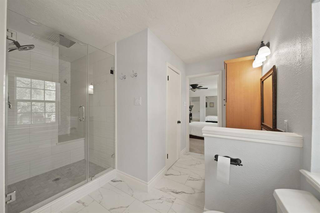 The spacious walk-in shower also has a bench and rain heads!