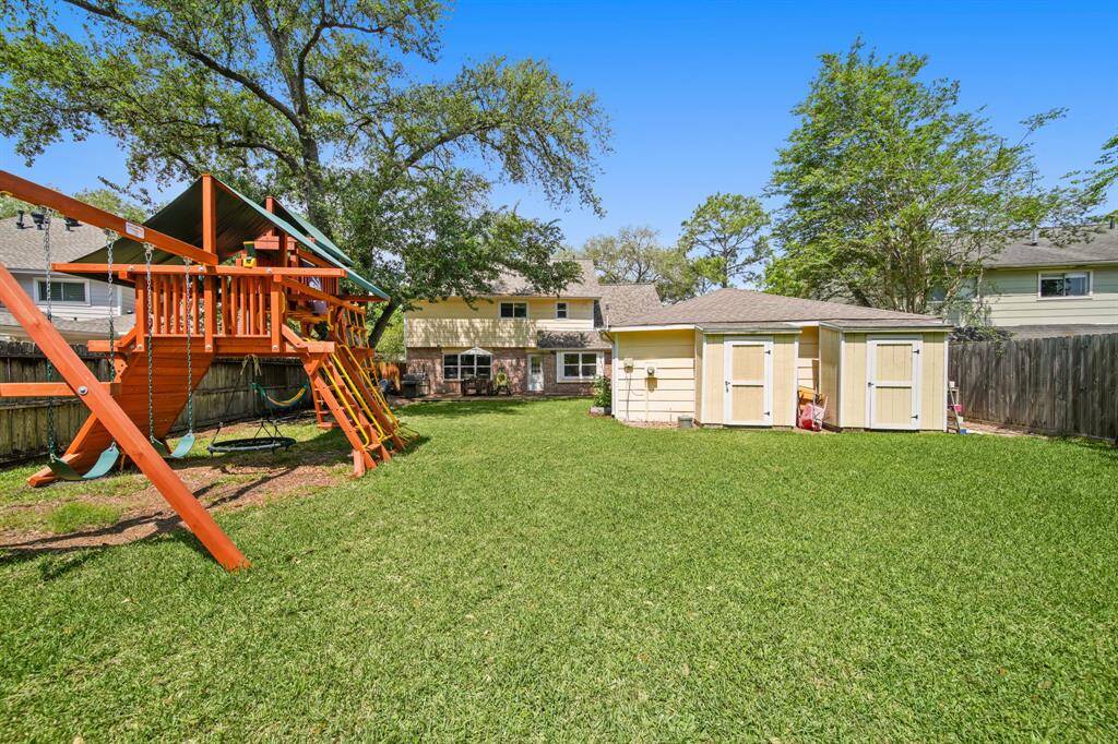 Come and see this spaciousbackyard with garden, fruit trees, and butterfly garden.