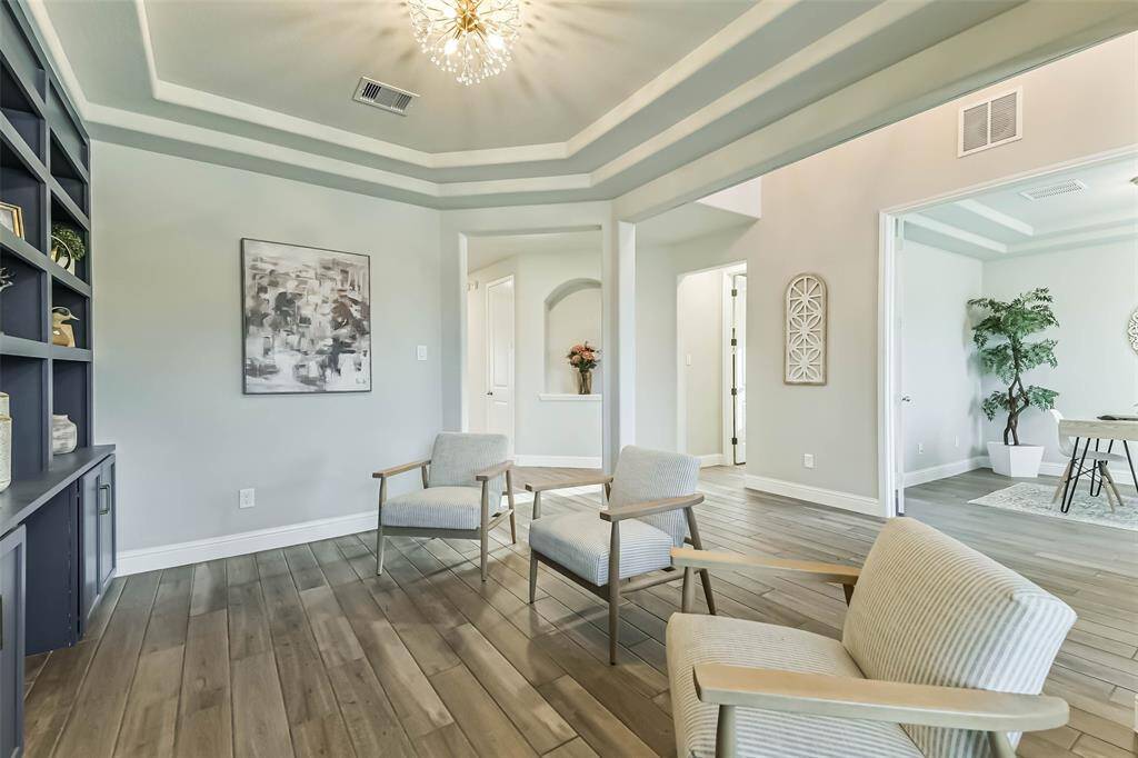 Large formal dining room/sitting room opens to the entry with the study across the way.