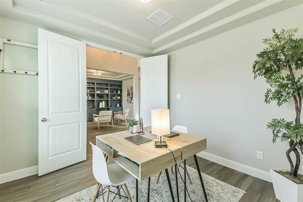 Double French doors provide privacy for the study.