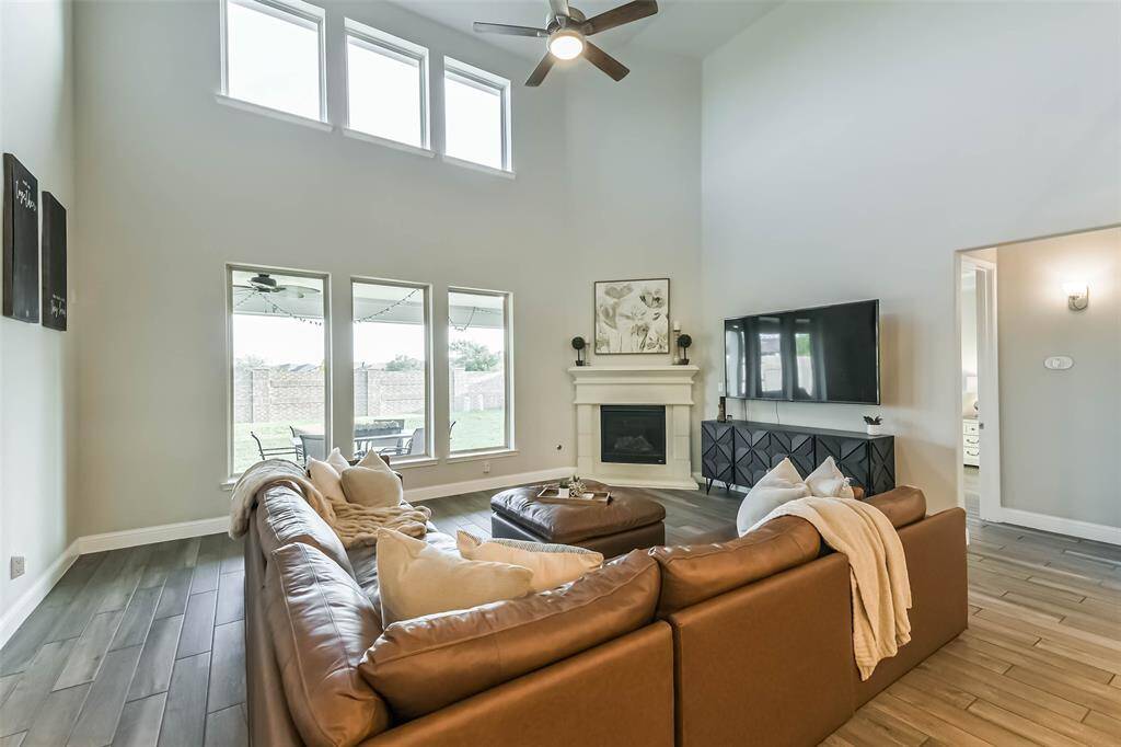 Plenty of space for a large sectional and more with a view towards the covered back porch and brick wall.