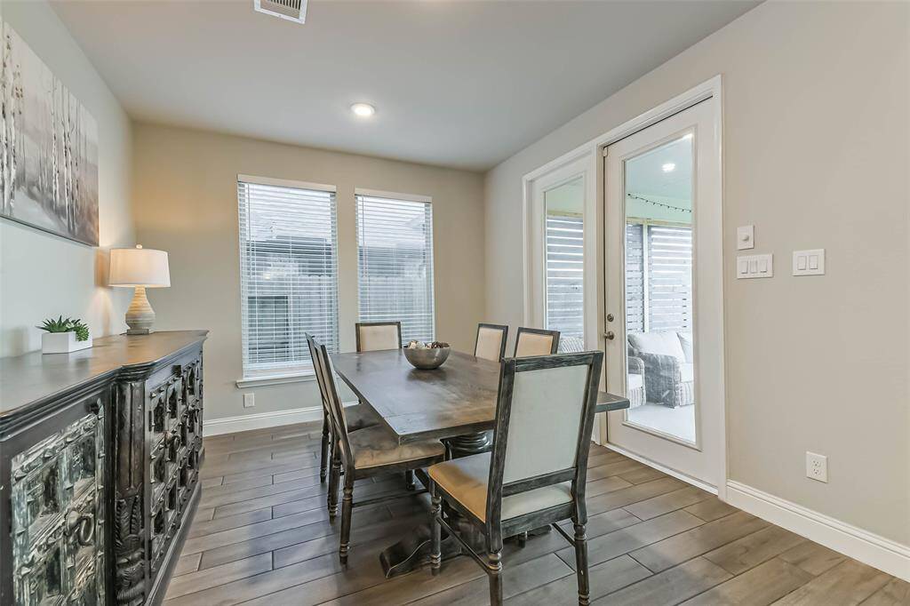 Generous breakfast room with multiple windows has space for a large table.