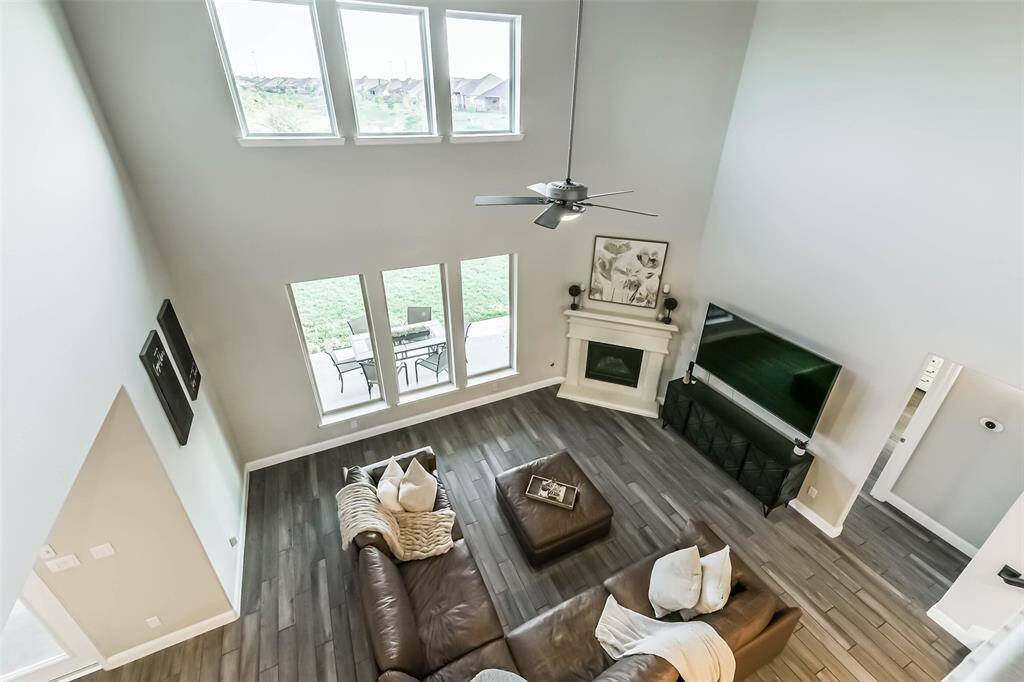 Game room overlooks living area with a perfect view to the lake behind the home.