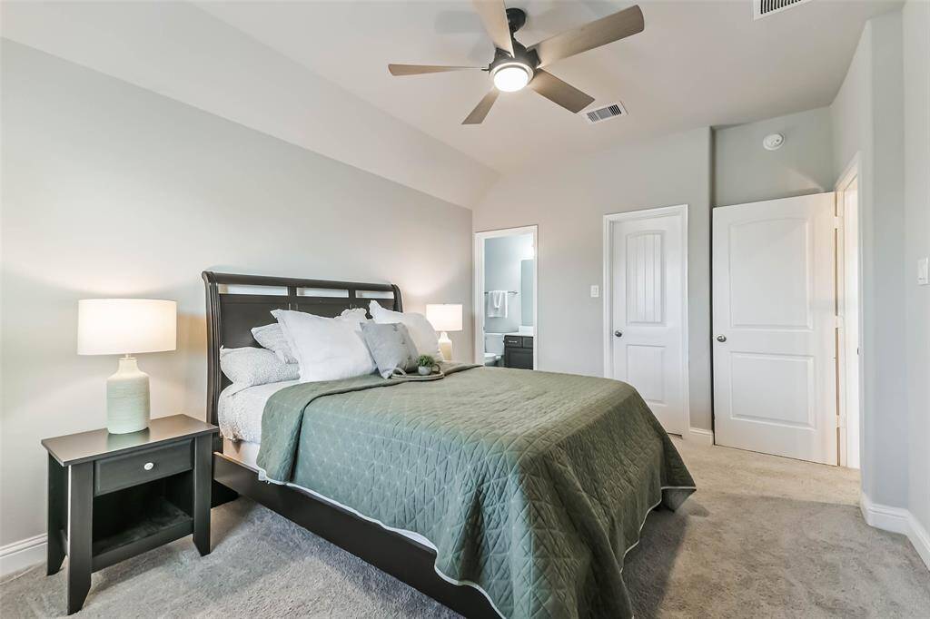 Second spacious bedroom has ceiling fan, walk-in closet, and ensuite bath, along with views of the park and lake.