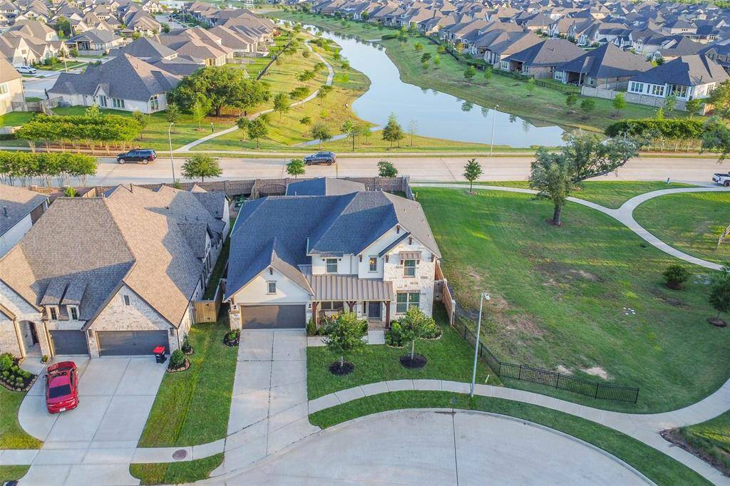 Lake behind, lake in front, and park with mature trees. No back neighbors, no side neighbors, and at the end of the culdesac with easy access to the walking trails around multiple lakes.