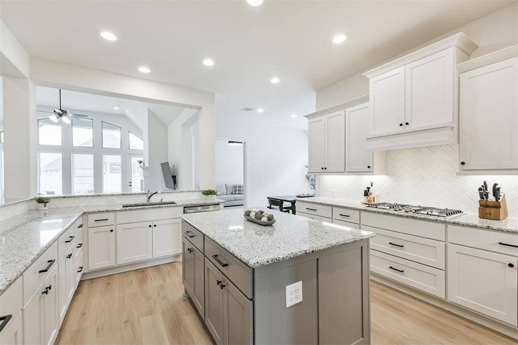This kitchen is so light and bright with natural light and LED ceiling fixtures, plus undercabinet lighting.