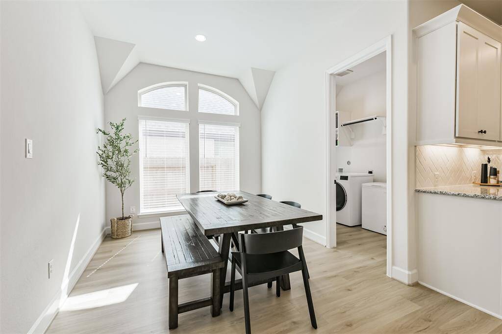 The breakfast room also has arched windows for lots of natural light and adjoins the laundry room and game room.