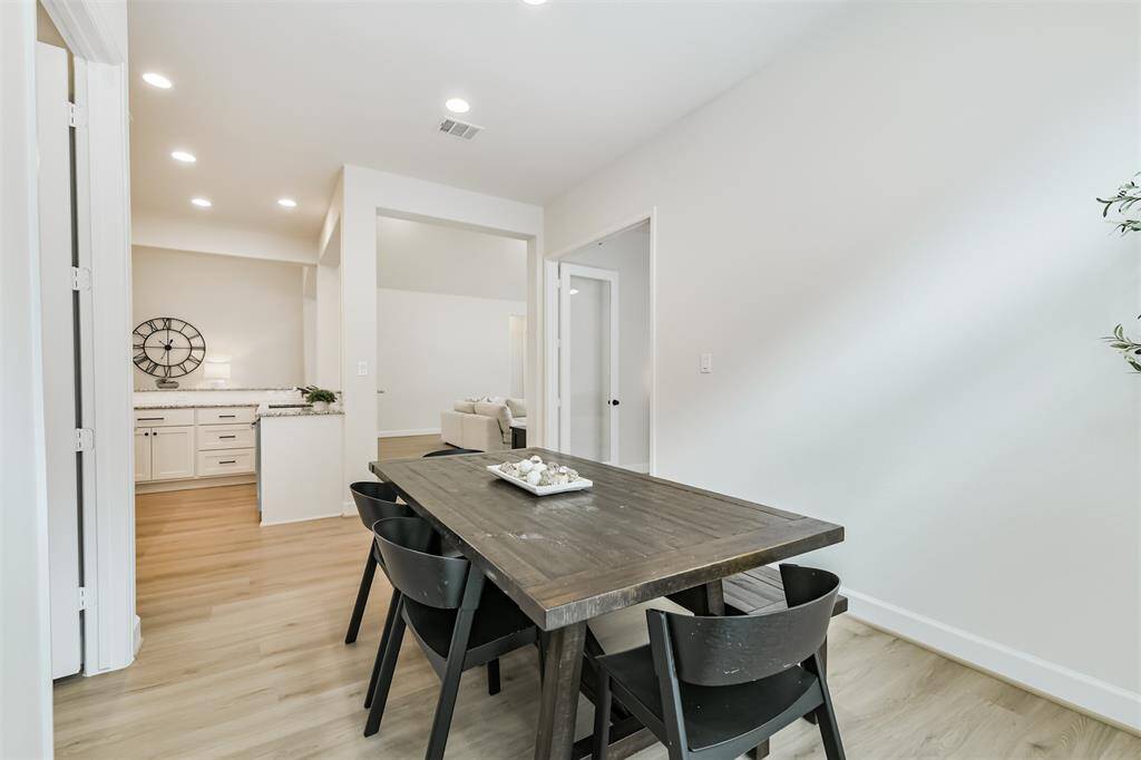 Just a few steps from the kitchen to the breakfast room - lots of space to dine in this home, perfect for entertaining!