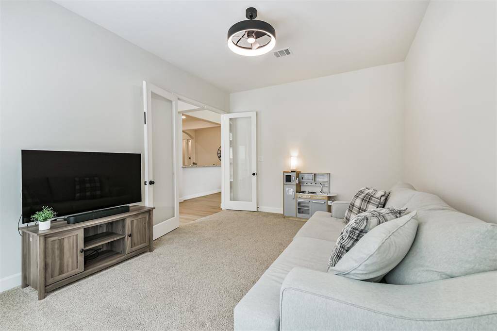 The large game room can be open to the other living areas or be its own private space with double French doors.