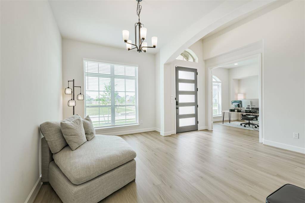 Formal dining connects to entry with arched opening. Study is directly across the hall.