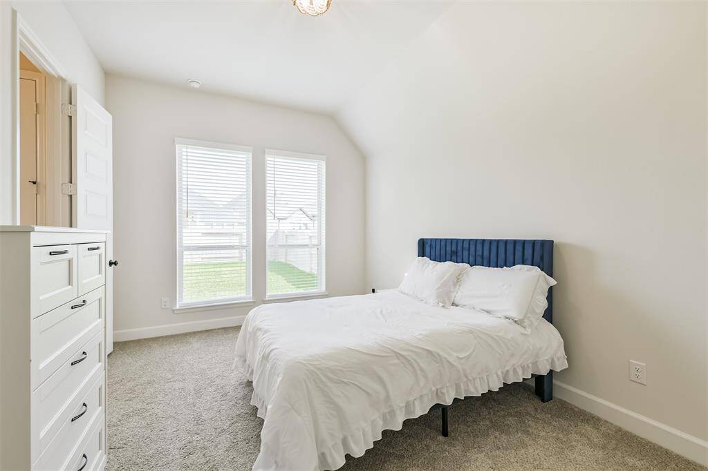 Oversize 4th bedroom looks to the back of the house and has its own ensuite bath.
