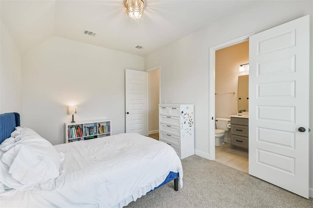 4th bedroom with upgraded light fixture and ensuite bath