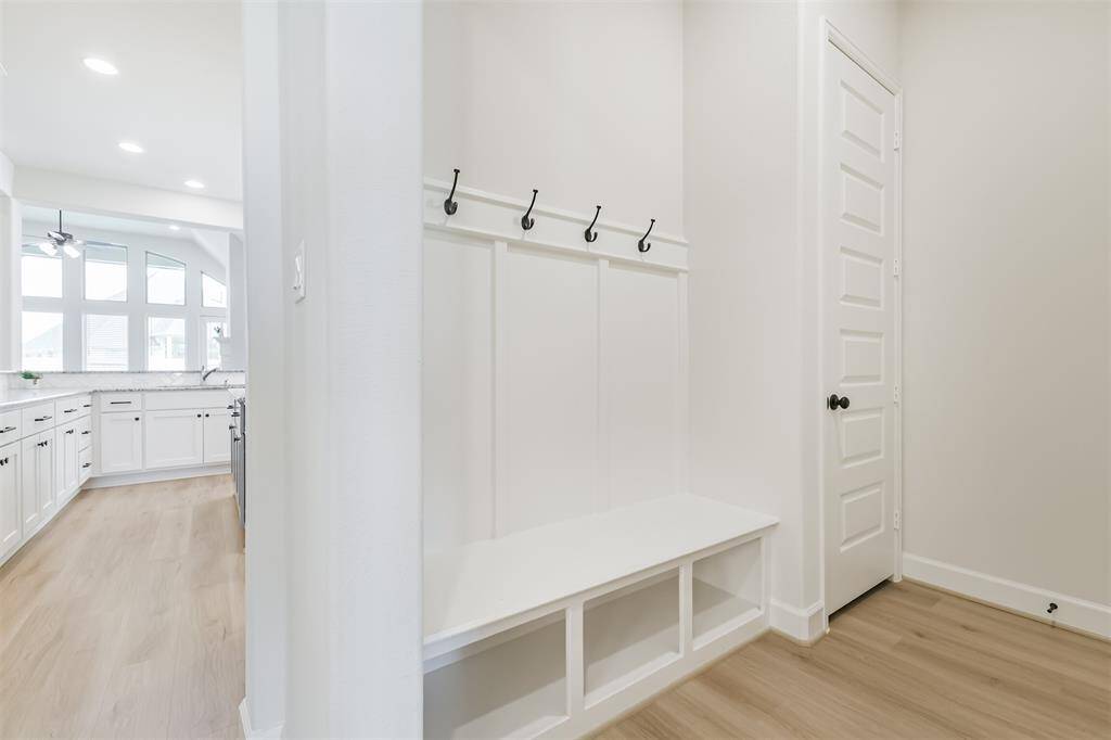 Mud room off the garage entrance adjacent to kitchen and butler's pantry with another closet. So much storage in this home!