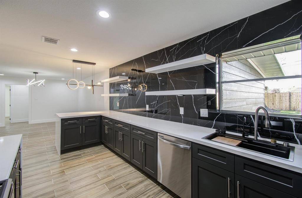 This gorgeous kitchen with this unique design will surely be the focal point of this home.