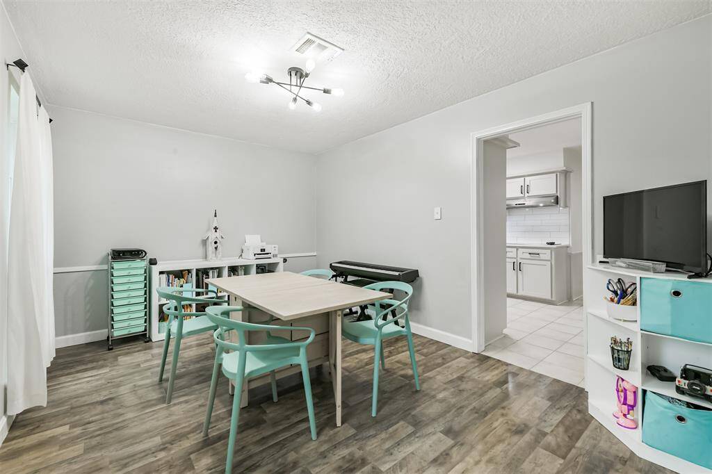 To the left of the entryway is the formal dining room that connects to the kitchen.