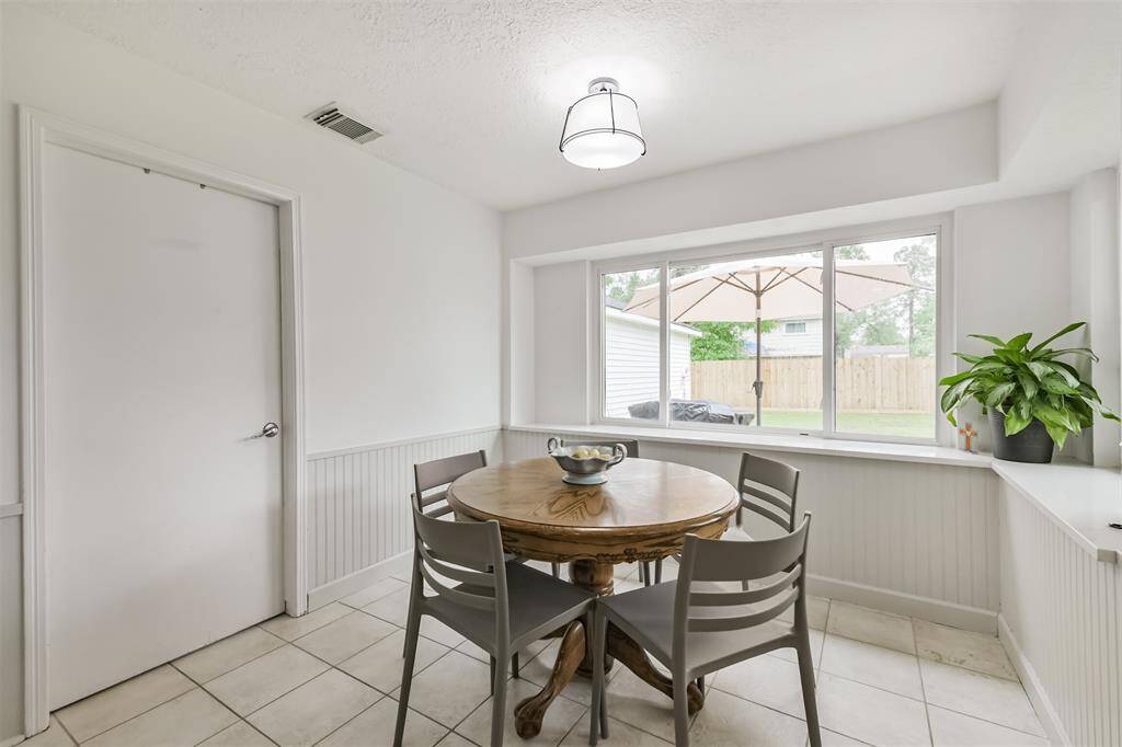 Let's take a step into the eat-in kitchen area. The door to the left leads to the in-home utility room.