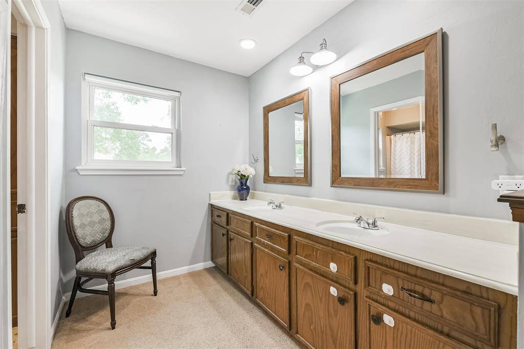 A large vanity area fitted with double sinks.