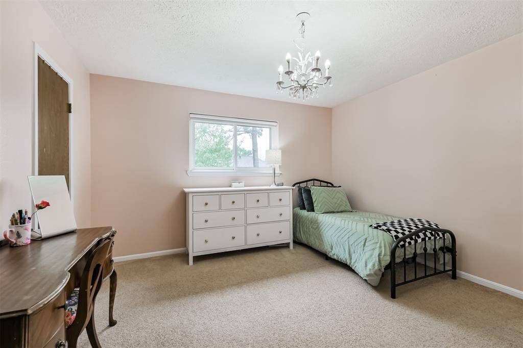 Just next door is another generously sized room with walk-in closet.
