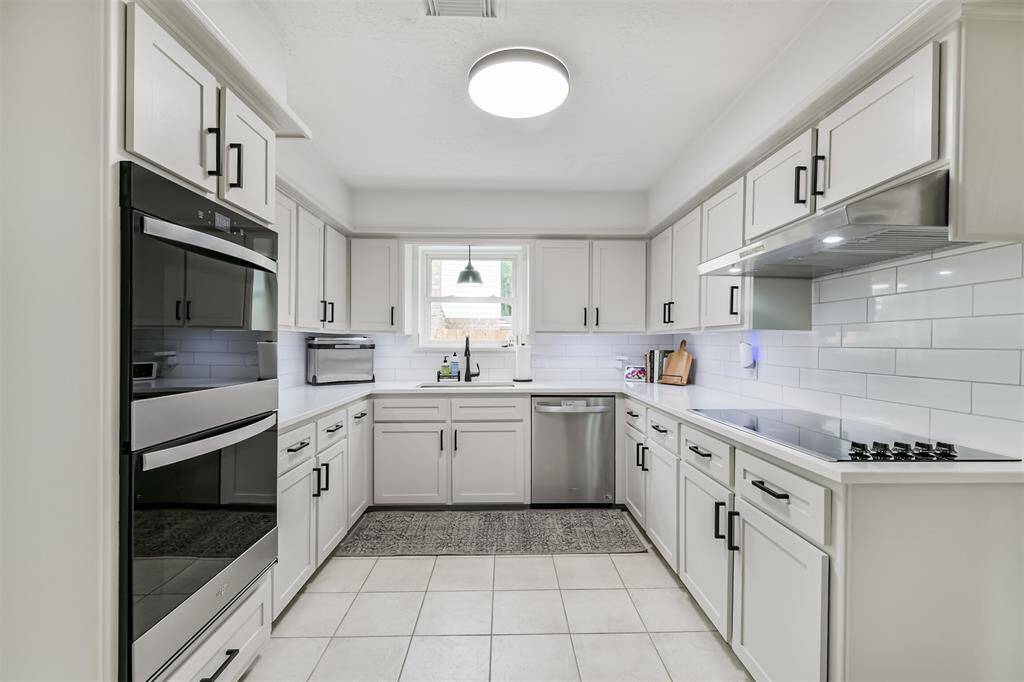 Fully remodeled kitchen sneak peek! You can see the ample storage cabinets available. BONUS: the double WIFI ovens!
