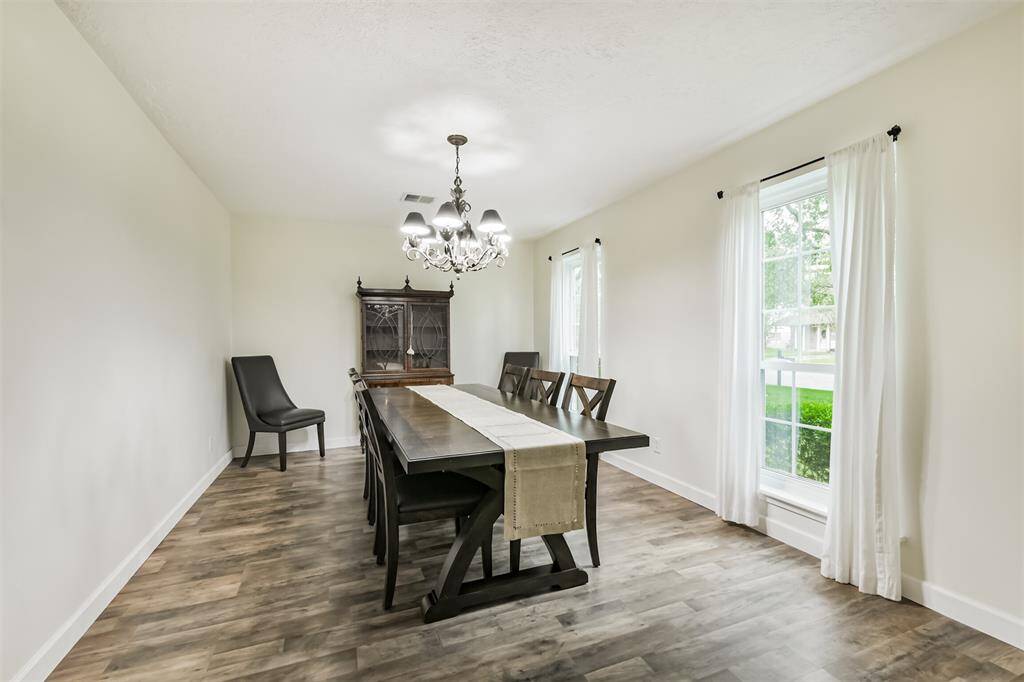 Back to front of the home! To the right of the entry is the formal living room currently staged as a dining room.
