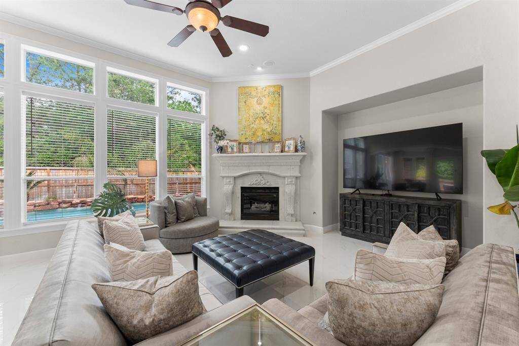 Spacious living room with gas log fireplace and the perfect area for your TV.
