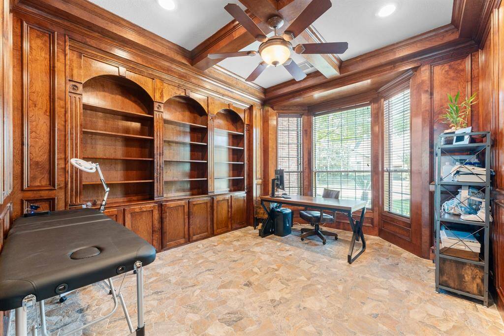 At the front of the home, you will find this handsome office with stone floors.