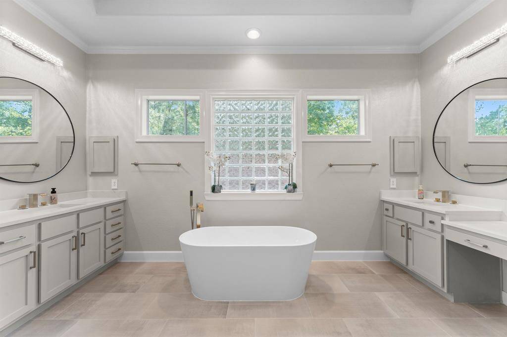 His and her sinks with new light fixtures.  What a great space.
