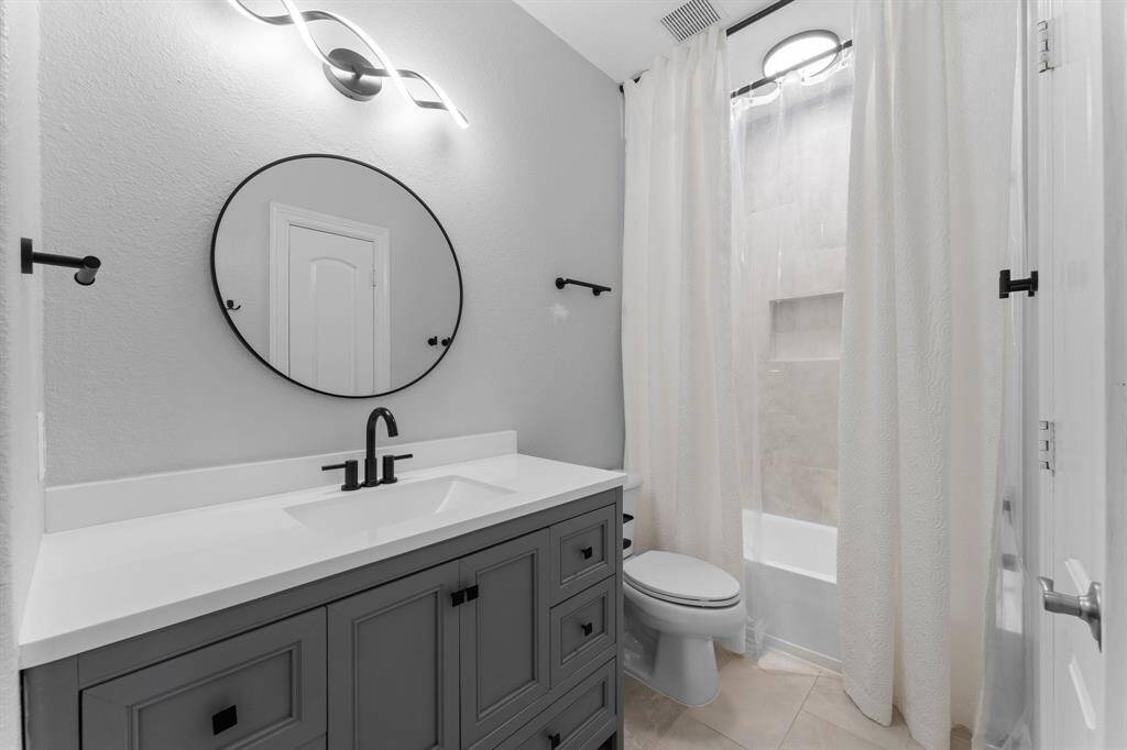 Second full bathroom upstairs is easy access to secondary bedrooms and media room.
