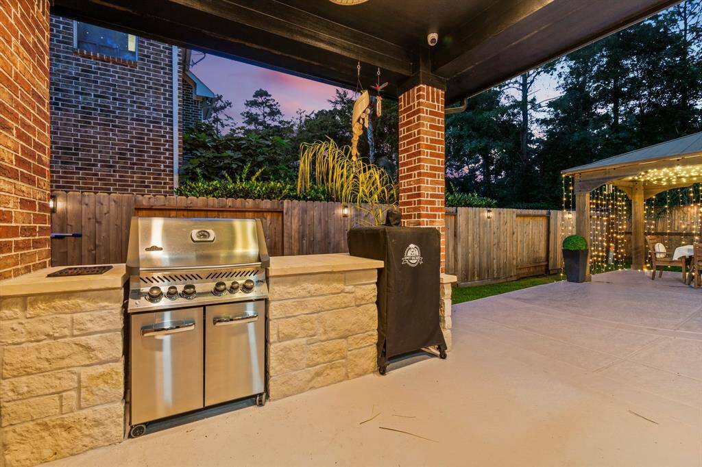 Covered outside kitchen and newly painted pool decking.