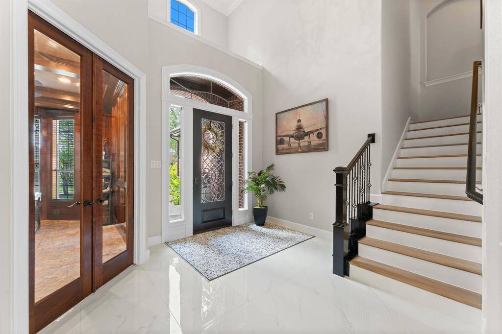 View of the two story grand entrance. Newly updated flooring throughout home.