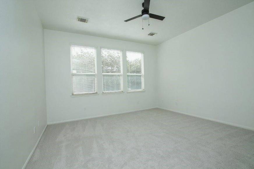 Primary bedroom overlooks pool