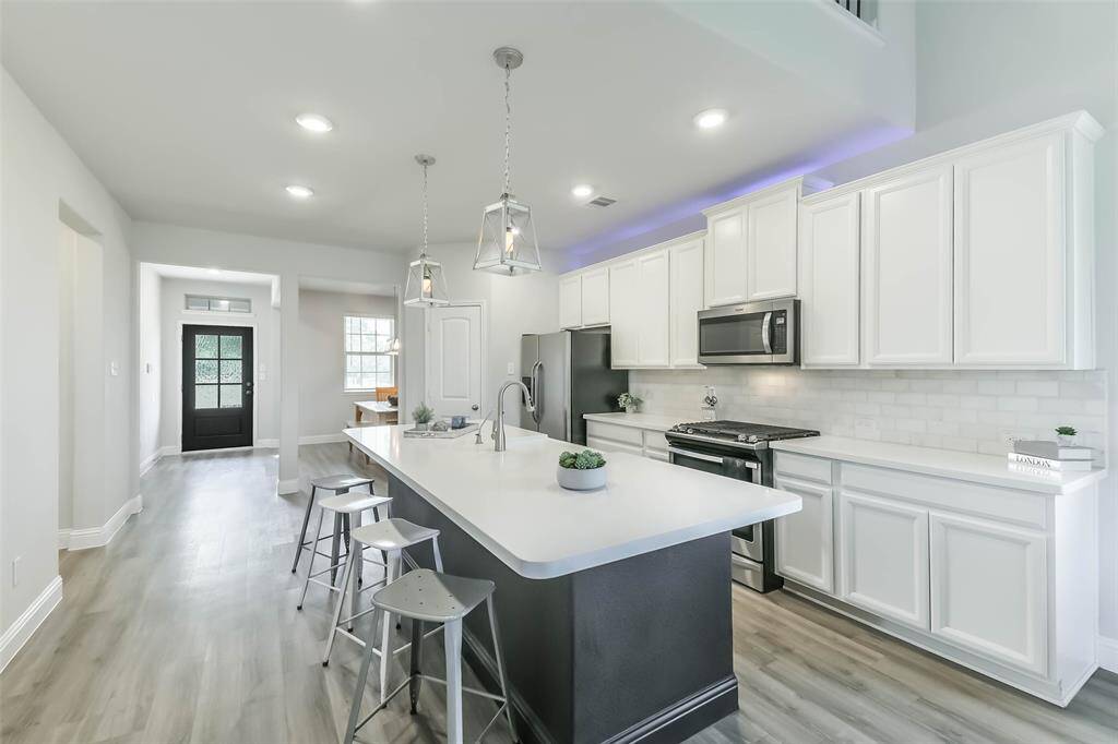 Kitchen is extended for even more counter and cabinet space.