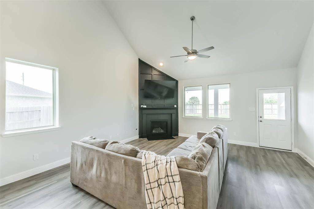 Light and airy living room has plenty of space for a large sectional.