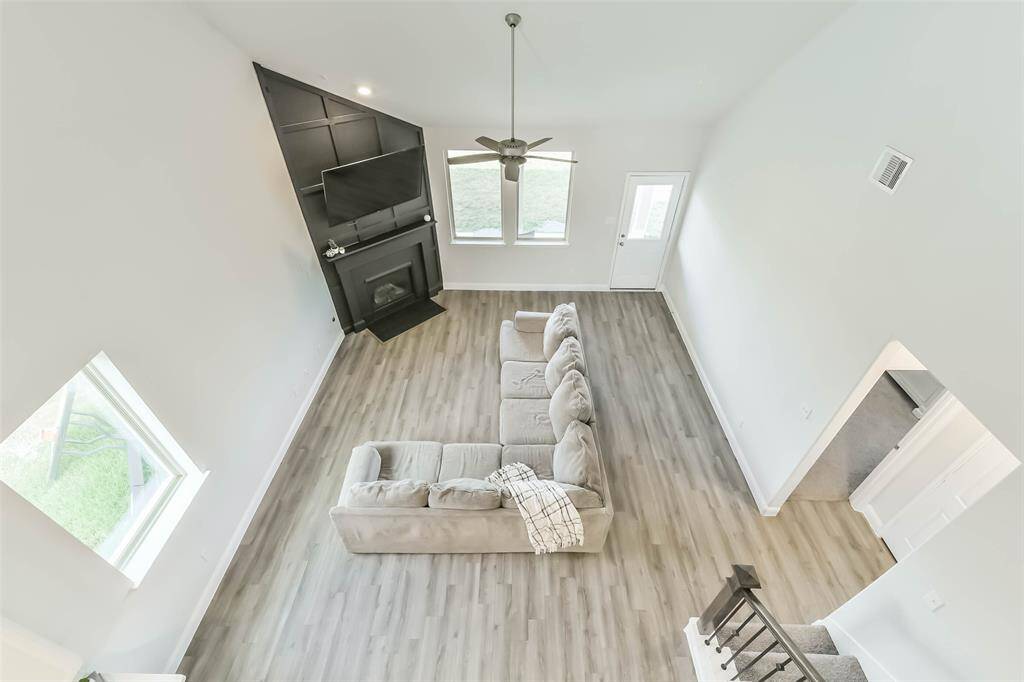 Game room overlooks spacious and bright living room.