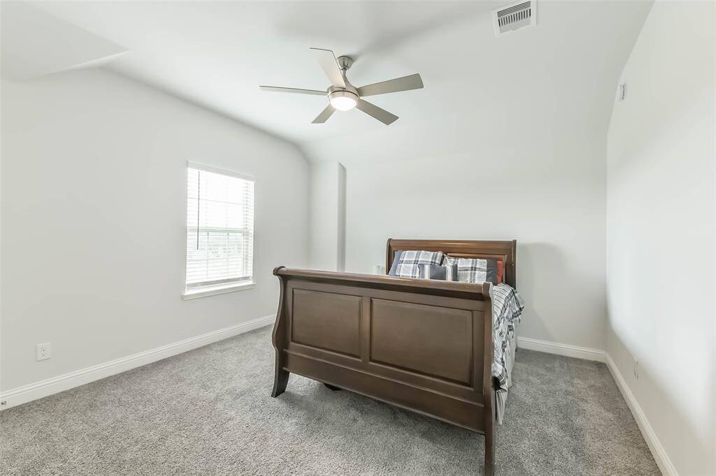 Second bedroom with ceiling fan