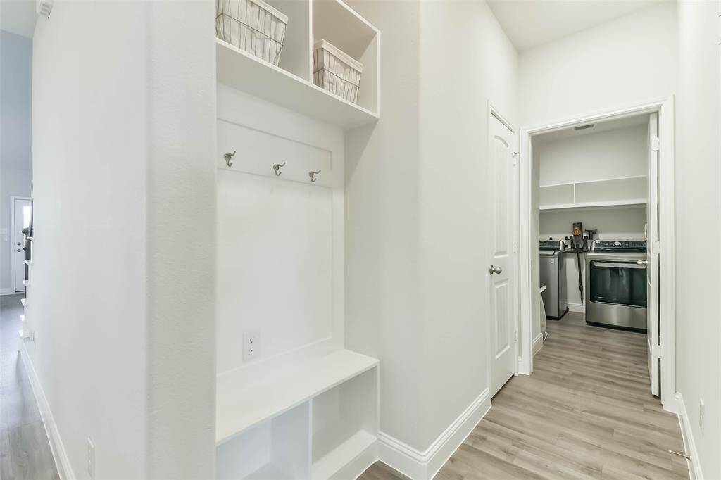 Mud room off the garage entrance with half bath and laundry room.