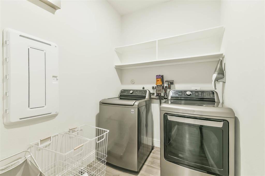 Large  laundry room with space for storage.