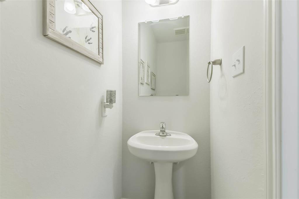 Half bath downstairs off garage entrance.