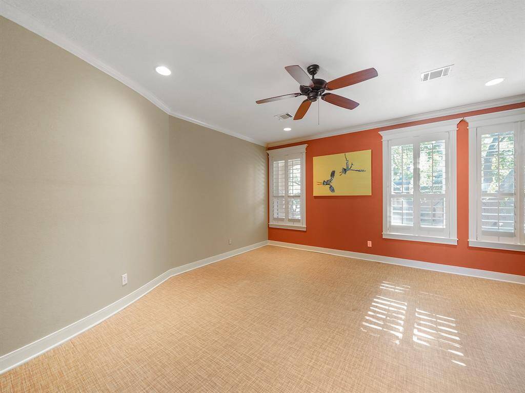 This spacious secondary bedroom (#1) offers a perfect blend of comfort and convenience, featuring a shared Jack and Jill bathroom that is ideal for family members or guests. With ample natural light and generous space, this bedroom provides an inviting atmosphere where relaxation meets functionality.