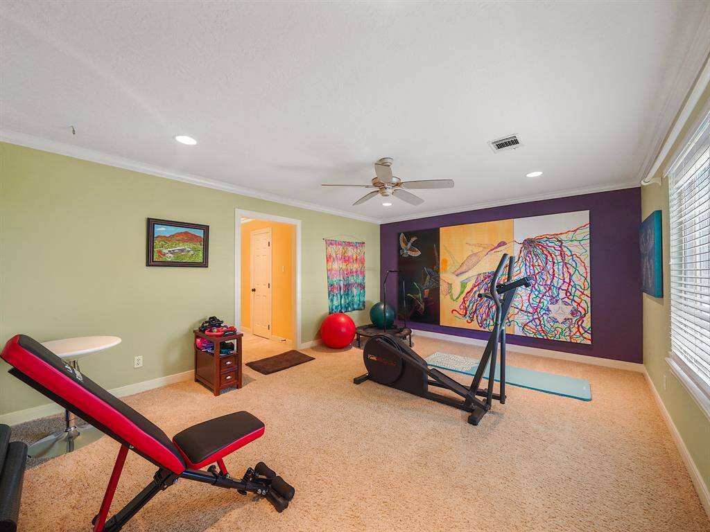 Discover the versatile charm of this secondary bedroom, currently transformed into a personal gym oasis. Shares a jack and jill bathroom with secondary bedroom #1.