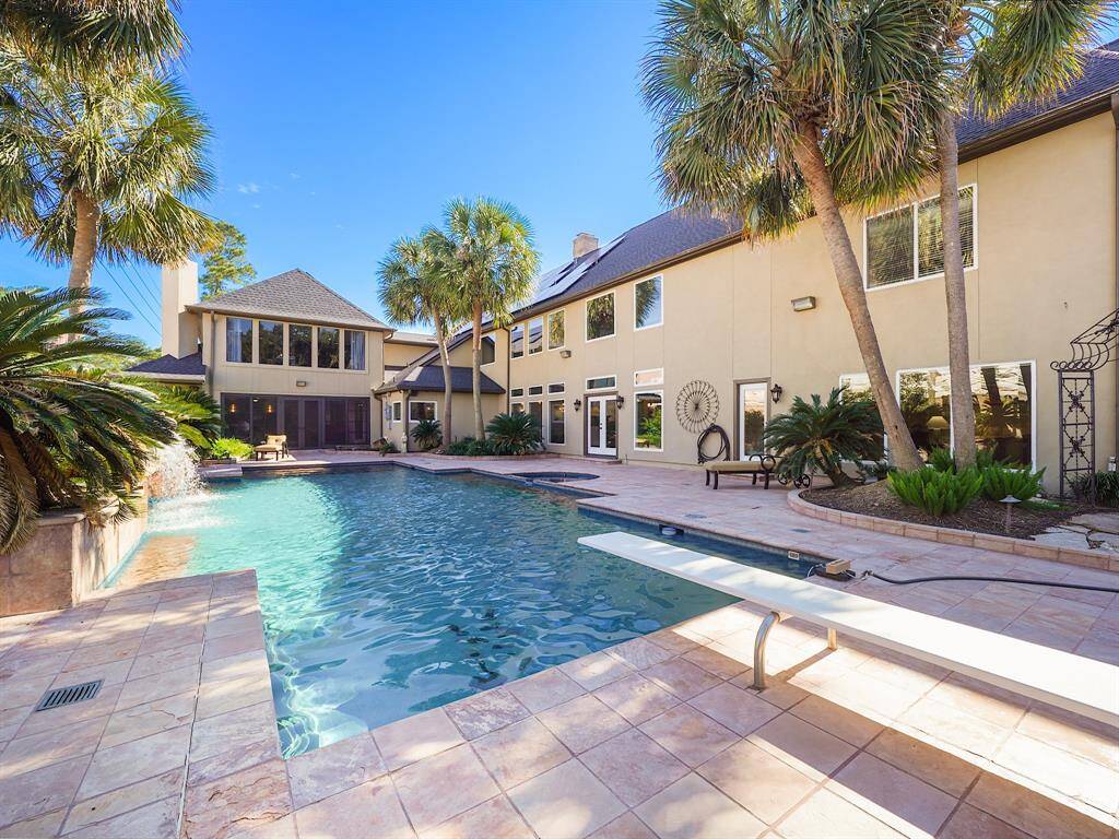 Enjoy sunny days lounging by the pool, and create cherished memories with family and friends in this inviting outdoor space.