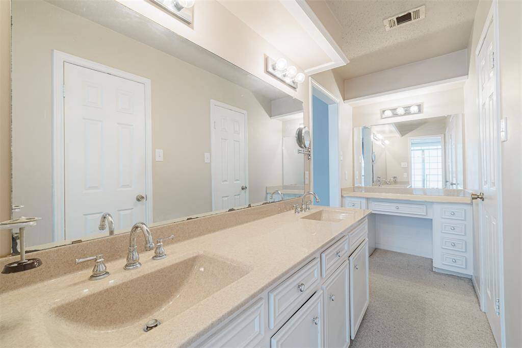 Vanity area separate from sink area.