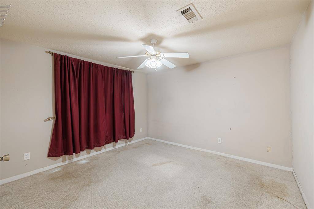 One of three secondary bedrooms.